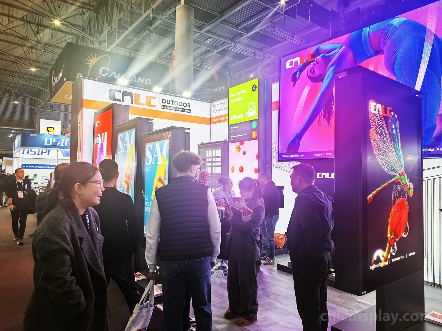 CNLC team discussing outdoor LED Totem features with a customer at ISE 2026.